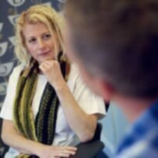Jen McCanna speaking with colleague