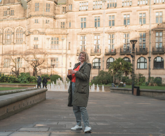 Jen McCanna standing with coffee outside in Sheffield