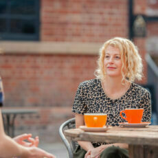 Jen McCanna image with friend drinking coffee